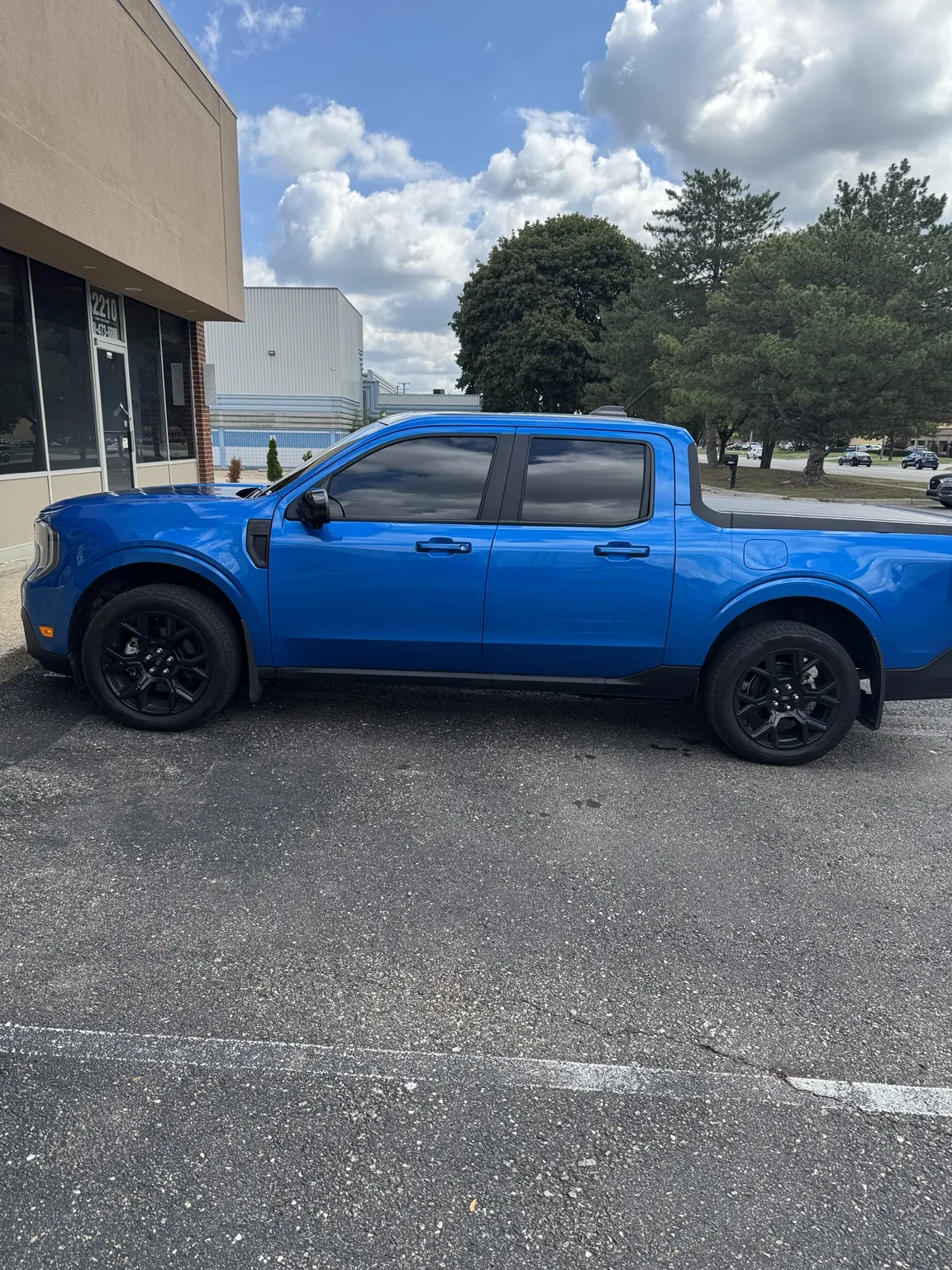 Blue Ford Maverick with window tint