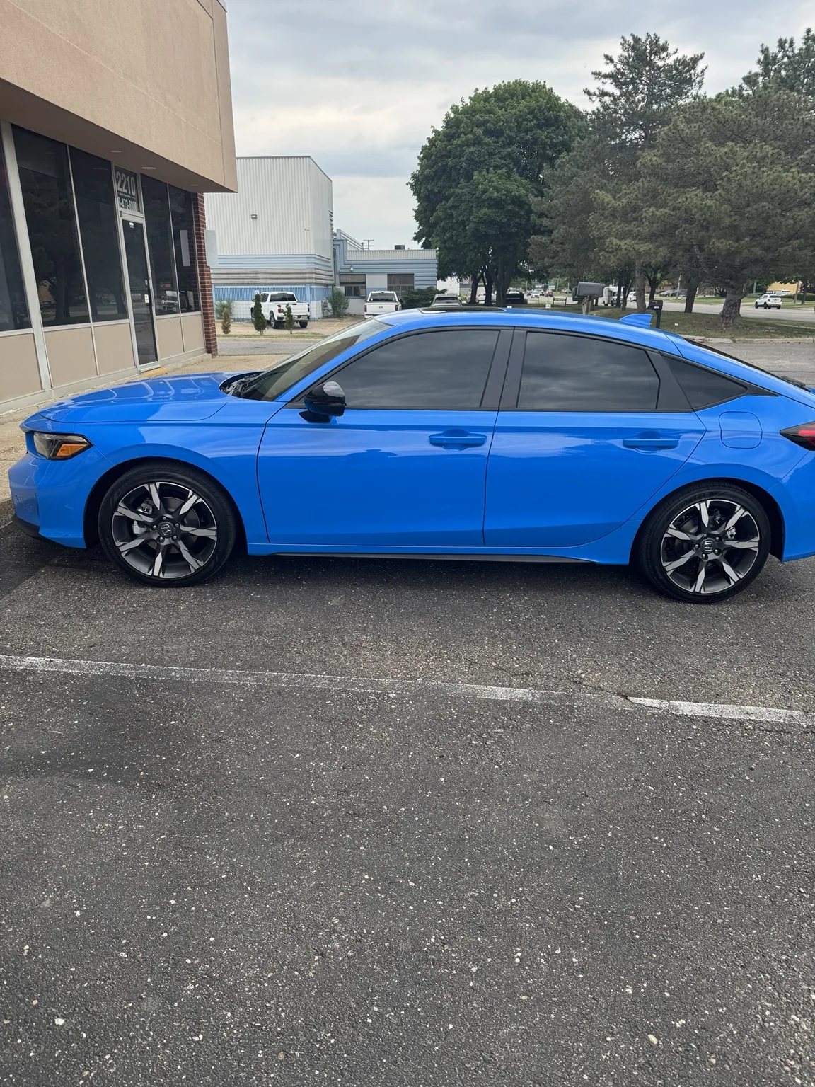 Blue Honda Civic with professional window tint at Pro Tint in Farmington Hills